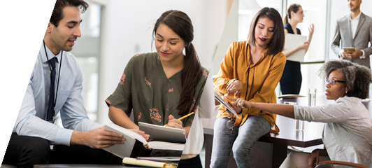 image of seated south-asian man and woman talking in business setting and image of south-asian woman showing a document to a seated black woman